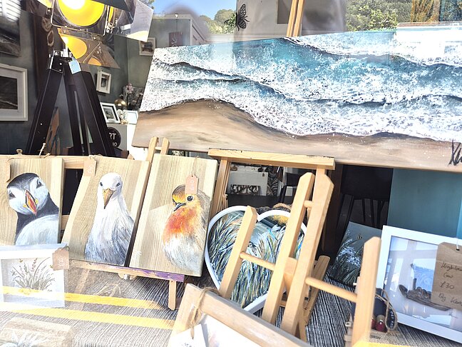 Kerry Munn Art studio window displaying paintings.