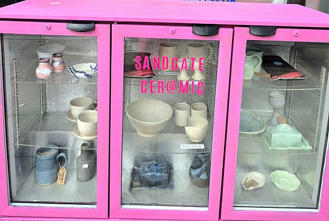 Sandgate Ceramic display cabinet outside Prater Raines.