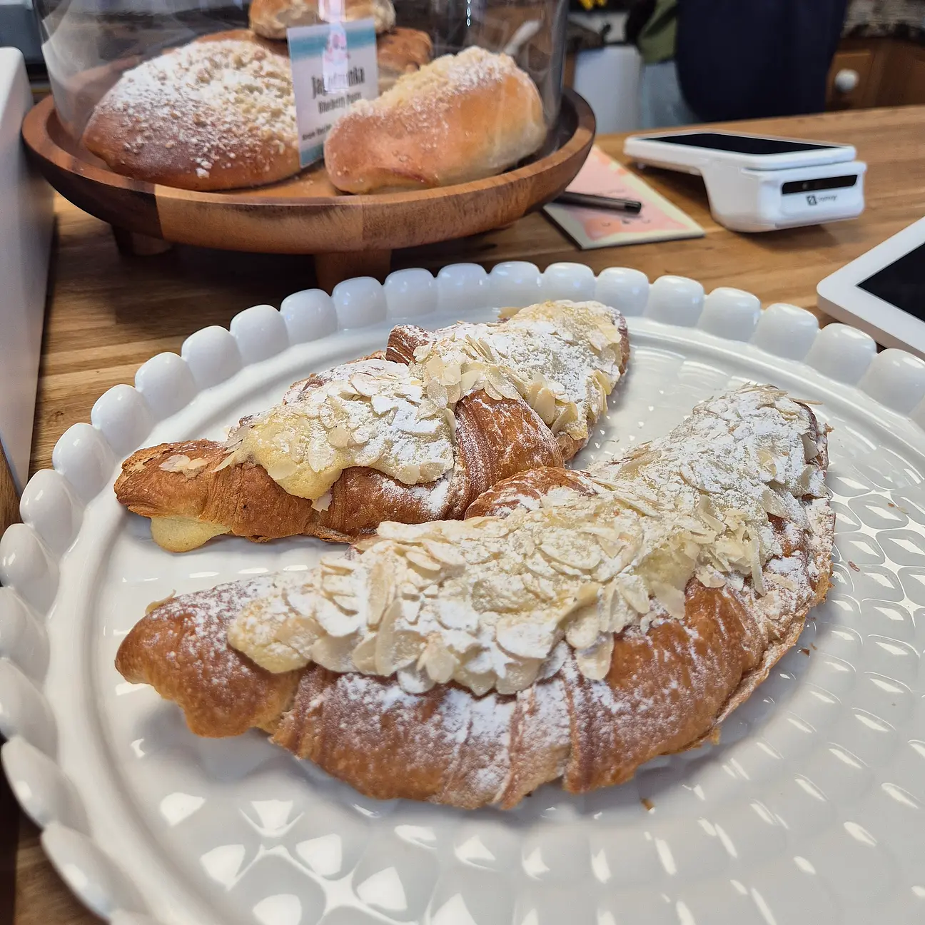 Two almond croissants on a plate